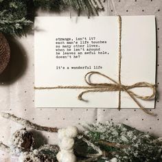 a christmas card with a poem written on it next to pine cones and evergreen branches