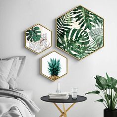 three hexagonal mirrors hanging on the wall above a bed