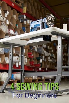 a sewing machine sitting on top of a table in a room filled with lots of shelves