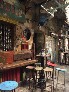 several stools and tables in an old building