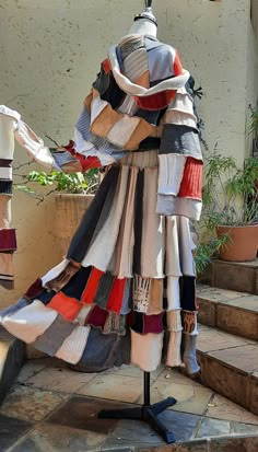 a mannequin made out of different colored fabrics