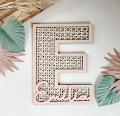 the letters e and f are made out of wood, with paper fans around them