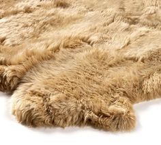 an animal fur rug is laying on the floor