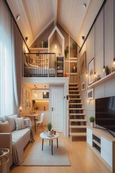 a living room filled with furniture and a flat screen tv on top of a wooden floor