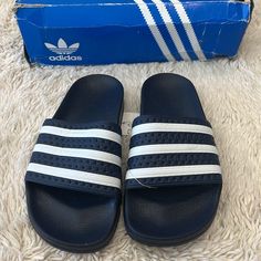 Adidas Adilette J Originals Navy Blue Slides With White Strips Size 4 Nwt Comes With The Box But The Box Is Pretty Beat Up Adidas Blue Sandals For Spring, Spring Blue Adidas Sandals, Blue Slide Slippers For Spring, Adidas Blue Slip-on Sandals, Adidas Blue Slip-on Slides, Blue Summer Slides With Round Toe, Blue Round Toe Summer Slides, Adidas Blue Slides For Beach, Blue Adidas Synthetic Slides