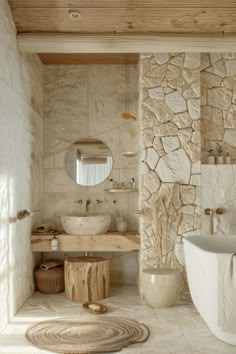 a bathroom with stone walls and flooring next to a bathtub in the corner