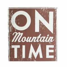 a brown and white sign that says on mountain time with the word'on '