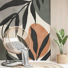 a chair, rug and potted plant in front of a wall mural