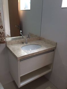 a bathroom with a sink and mirror in it