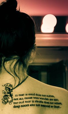 a woman with a tattoo on her back that says, i am not afraid to do something