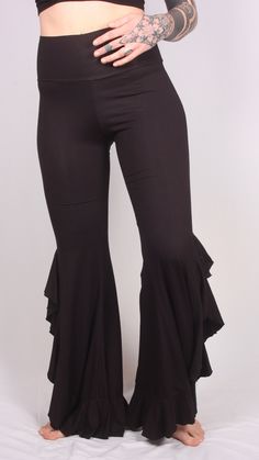 Our Long Ruffle Pants are great for a night out dancing. They are very flattering and recommended for taller women due to the fact that they are longer. These pants are extremely comfortable and fit slightly smaller. I would recommend going up one size. Elegant Black Flares For Party, Fitted Ruffled Pants For Evening, Fitted Pants With Ruffles For Evening, Fitted Evening Pants With Ruffles, Elegant Full-length Flares For Night Out, Elegant Full Length Flares For Night Out, Black Fitted Flares For Night Out, Stretch Black Flares For Night Out, Black Stretch Flares For Night Out