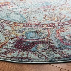 an area rug is shown on the floor with wood floors and hardwooding in the background