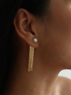 These perfect everyday long tassel earrings comprise of a dainty round freshwater pearl and shiny gold herringbone-like chain threads. The tassels are dynamic, chic and glam.The ear jacket design offers 2-way wear. To dress down, the tassel part (back side) can be taken away and replaced with normal ear posts. Multi-purpose and fits all occasions.• S P E C I F I C A T I O N •Drop Length: approx. 55 mmWidth: approx. 10mm widest (metal part)Earring Post: S925 HypoallergenicSilver: Newly addedNote: The pearls we used come from nature, each is unique and has slight differences in shape. There may be minor imperfections but shall not affect the overall outlook of the jewelry Gold Thread Earrings, Real Pearl Earrings, Tassel Earing, Freshwater Pearl Drop Earrings, A Ponytail, Long Tassel Earrings, Real Pearls, Pearl Stud Earrings, Fringe Earrings