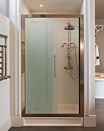 a walk in shower sitting inside of a bathroom