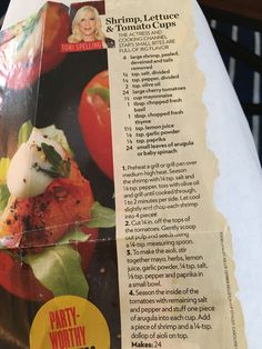 the menu for shrimp - lettuce and tomato salad is displayed on a table