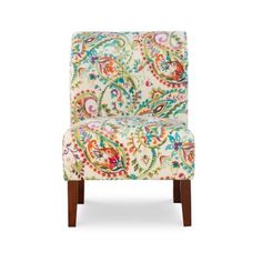 an upholstered chair with colorful paisley print on the back and legs, against a white background