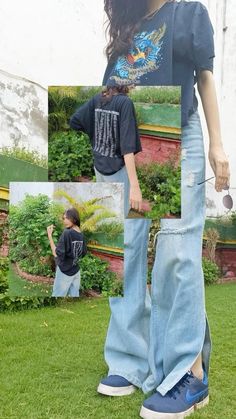 a woman standing on top of a lush green field next to a man wearing blue jeans