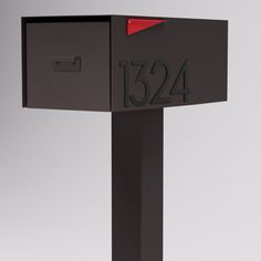 a black mailbox with the number 1234 on it's front and side