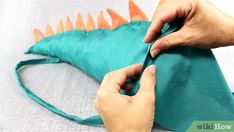 someone is making an origami dragon pillow