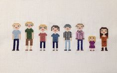 the cross stitch people are standing in a row