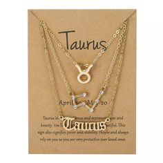 two gold necklaces with zodiac signs on them and the words taurus written in roman numerals