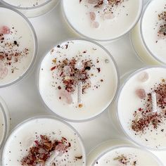 several white candles with different types of stuff on them