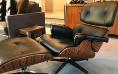 an eames chair and ottoman in a store