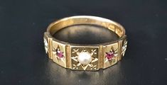 A gorgeous antique late Victorian 15ct gold ring.  Central seed pearl with alternate seed pearls and rubies. The band is stamped to show that it was assayed in Birmingham, dating to 1901 and made by henry Hyde & Sons.  The ring measures between L1/2 and M on the ring sizer. The ring is in lovely antique condition with normal surface wear commensurate with its age.  💐Buy as much as you like for only one shipping charge we don't charge extra for any additional item💐 Please look at all photograph Antique Ruby Ring, Etsy Gold Ring, Ring Sizer, Seed Pearl, Multi Stone Ring, Ruby Ring, Multi Stone, Ear Jewelry, Antique Rings