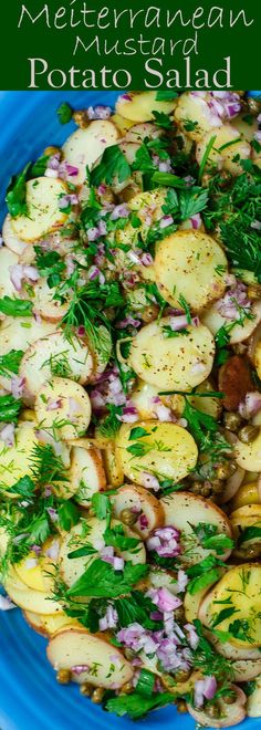 a blue plate topped with potatoes and herbs