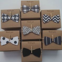 several small boxes with bow ties on them