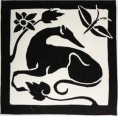 a black and white tile with flowers on it