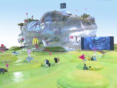 an inflatable structure with people and cows on it