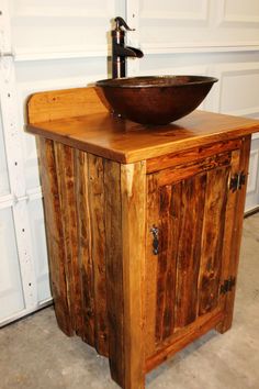 a sink made out of wood with a bowl on top