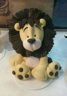 a lion figurine sitting on top of a table