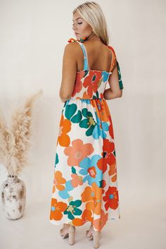 This stunning Genny Floral Print Maxi Dress is the perfect addition to your wardrobe. The vibrant print and flowy design will make you stand out in any crowd. With a flattering fit and comfortable material, you'll feel confident and beautiful all day long. Perfect for any occasion, this dress is a must-have for every fashion-forward individual. Material:100% Polyester Model info: Models are 5'7", Size 2, wearing smalls Floral Print Design, Floral Dresses Long, Square Neck Dress, Floral Print Maxi Dress, Floral Print Maxi, Basic Style, Wide Leg Jumpsuit, Floral Maxi, Fitted Bodice