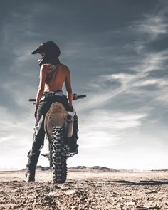 a person on a dirt bike in the desert