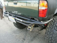 the back end of a pickup truck parked in a parking lot