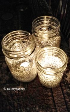 there are three jars with gold glitter on them