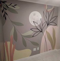 an empty room with a painted mural on the wall