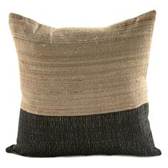 a black and tan pillow with two different colors