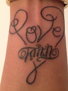 a woman's wrist tattoo with the word faith written in cursive font