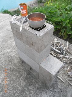 there is a bowl on top of a fire pit