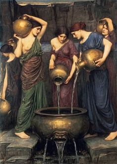 three women are washing their hands in a fountain