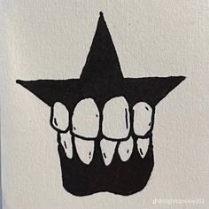 a black and white drawing of teeth in the shape of a star on a piece of paper