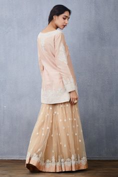 Peach short kurta with floral hand embroidered motifs. Paired with embroidered tulle sharara and embroidered tassel tulle dupatta.
Component: 3
Pattern: Embroidered
Type Of Work: Floral
Neckline: V Neck
Sleeve Type: Full Sleeves
Fabric: Kurta: Handwoven Chanderi, Sharara and Dupatta: Tulle
Color: Peach
Other Details: 
Hand embroidery
Tassel dupatta
Floral motifs
Occasion: Bride,Wedding - Aza Fashions Tassel Dupatta, Peach Shorts, Short Kurta, Embroidered Motifs, Types Of Work, Luxury Sale, Embroidered Tulle, Full Sleeves, Floral Motifs