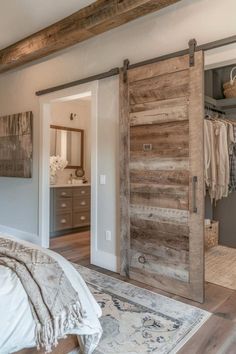 a bedroom with an open sliding barn door