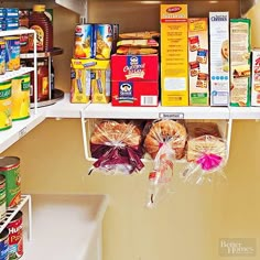 an organized pantry with canned food and snacks