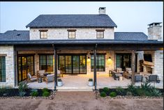 a house with an outdoor patio and seating area