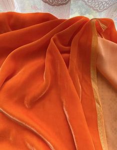 Orange Pink Color- Silk Velvet Fabric 30 Colors are available now Fabric Width: (113-114cm) 40Momme on average 1 piece = 1 yard If you order more than 1 yard, we will send you a whole piece.  Silk velvet has good gloss, high color saturation, beautiful style with fine fluff on the surface, soft hand feeling, shining shiny luster, and changing and flowing with the light, adding a refined and luxurious feeling to the clothes. The real velvet woven or we say silk velvet fabric is from mulberry silk and natural cotton fiber has good bio-compatibility with the human body, and the coefficient of friction stimulation to the human body is second only to silk fabrics, and the touch is soft and smooth, which makes people love it. The velvet clothes test tailoring and craftsmanship. We have made a un Bridal Anklet, Orange Pink Color, Silk Velvet Fabric, Velvet Clothes, Rose Orange, Half Skirt, Orange Fabric, Textiles Fashion, Silk Velvet