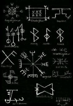 an image of ancient symbols written in chalk on a blackboard with white marker writing